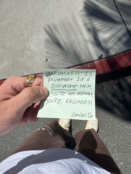 Handwritten sticky note with words of encouragement